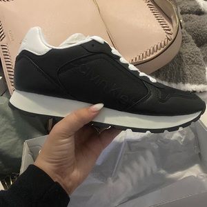 Never worn Calvin Klein black and white sneaker